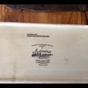 Tuscan butter dish with metal stand and handle.